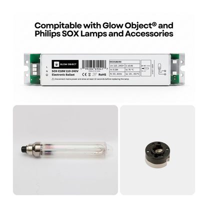 Electronic ballast, lamp, and BY22D socket compatible with Glow Object and Philips SOX lamps on a white background.